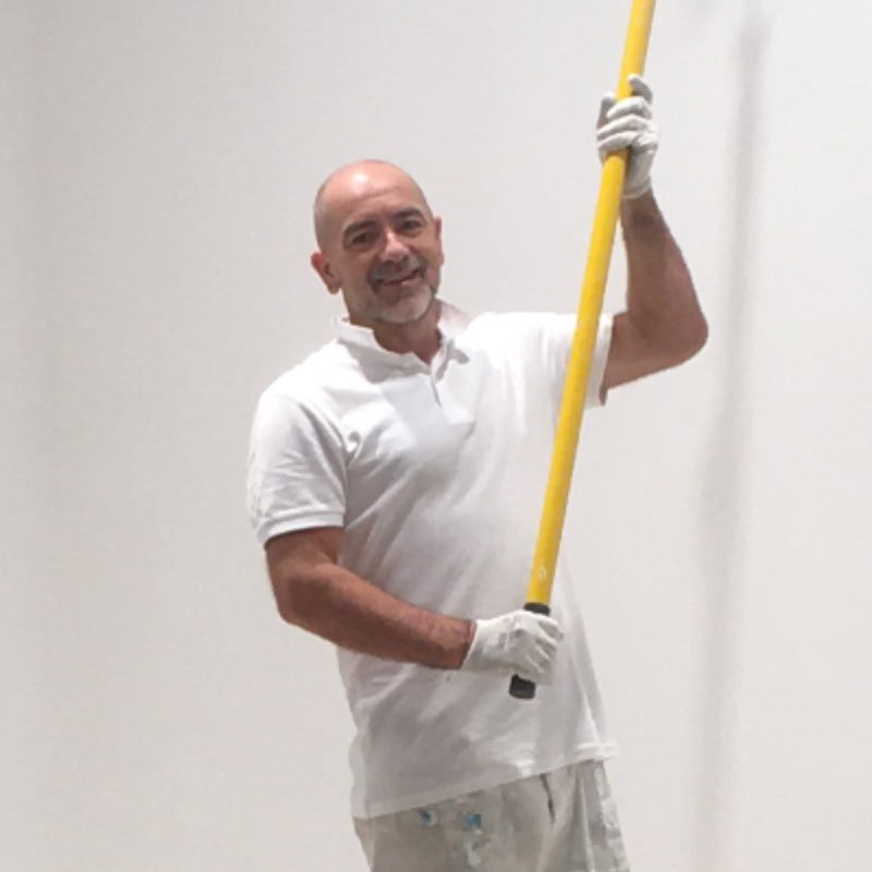 Painter & Decorator painting with a roller in Central London