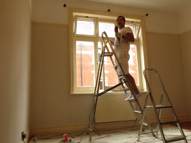 Sanding with a Fein Multimaster makes easy work of this window