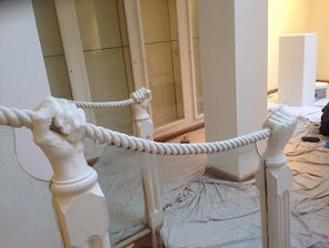 A quirky Art gallery in Central London showing the ornate handrail as the gallery is redecorated throughout