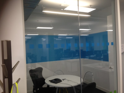 A cell office in Fitzrovia office painted blue showing a completed blue dry erase area