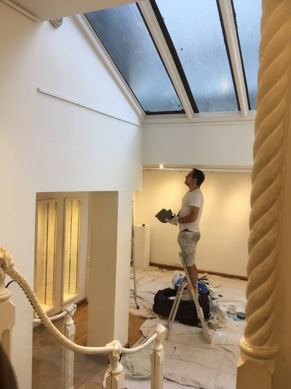 Painter & Decorator painting an art gallery in Central London