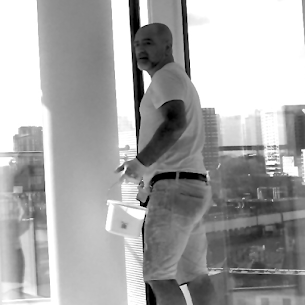 Painter Andrew painting in high rise apartment in Central London
